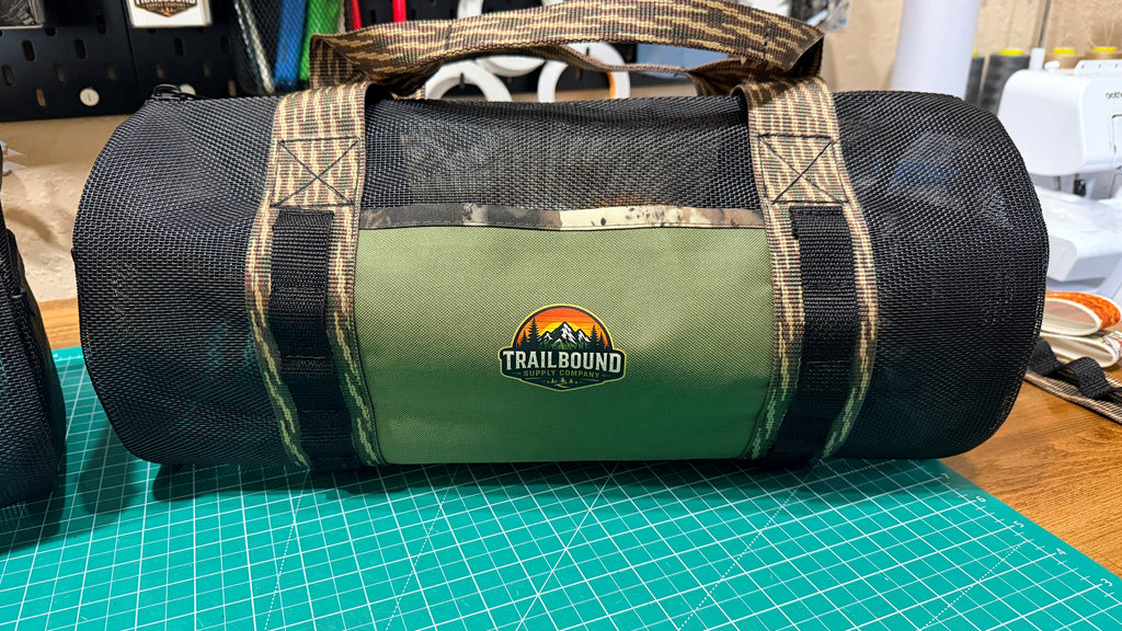 TrailBound Heavy Duty Mesh Utility Duffel | Black & Camo Edition